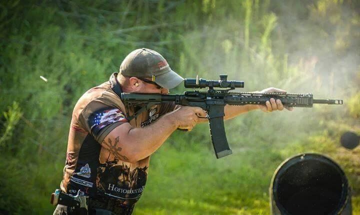 Garrett Grover shooting his rifle at a recent 3-gun event.  Rise Armament Triggers